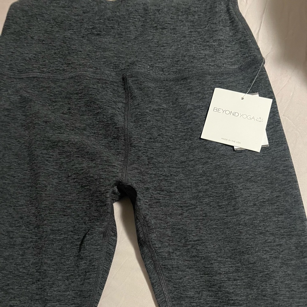 Never worn very soft beyond yoga pants fit more like a medium